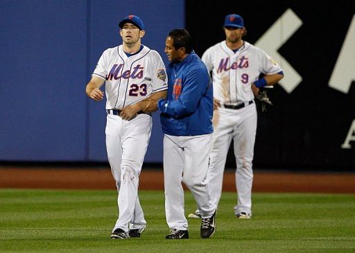 Left fielder Mike Baxter (L) left the game with a suspected shoulder injury